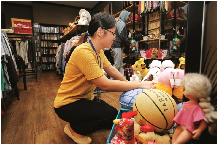 a sizeable collection of children’s clothing and toys take up an entire corner